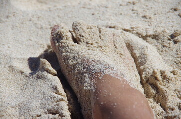 Sandy feet by the beach