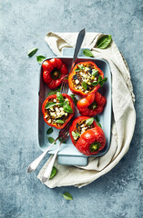 Peppers stuffed with minced meat, rice and vegetables. Topped with herbs and feta cheese