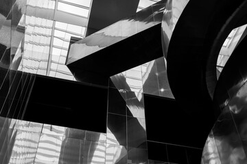 Black and white tone, Close up detail and low angle view at shining metal railing of curvature...