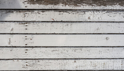 Weathered white painted wooden boards
