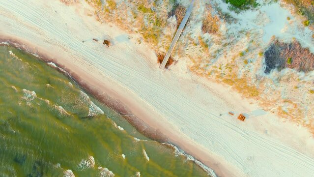 Aerial rotating top-down view of sandy Curonian Spit beaches, Baltic sea shore