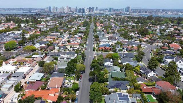 2023 - Excellent aerial view moving over a major road in a residential area of Coronado Island, San Diego, California.