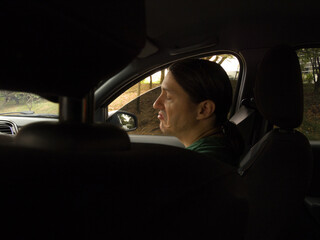 Man in Car Front Seat with Worried Expression
