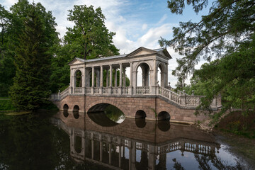 Marble bridge on the shore of a Large pond in the Catherine Park in Tsarskoye Selo on a sunny...