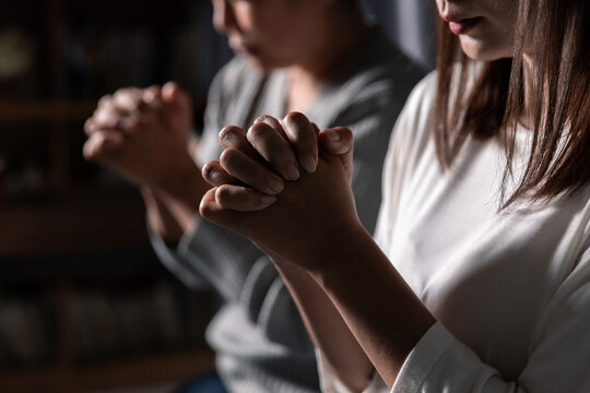 Group of different women praying together, Christians and Bible study concept.