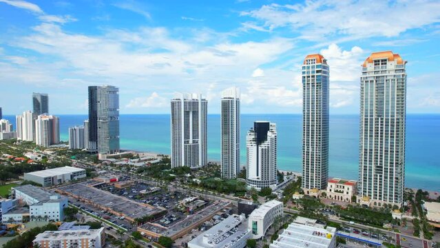Sunny Isles Beach Florida. Panorama of Miami Beach FL. Atlantic Ocean beach. Beautiful seascape. Turquoise color of sea water. Summer vacation in Florida. Aerial view on Hotels and Resorts on Island