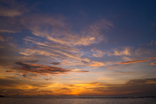The colorful sky at sunset and the reflection in the sea look amazing. Nature beautiful Light Sunset or sunrise over sea.Real amazing panoramic sunrise or sunset sky with gentle colorful clouds.