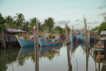 Hundreds of fishing boats of various shapes and sizes parked on the downstream side of the river....