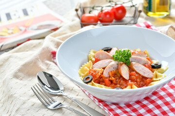 Sausage Penne Pasta with tomato sauce and fresh herbs, italian style