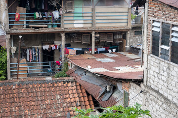 Densely populated buildings in narrow alleys around the city of Bandung, Indonesia.