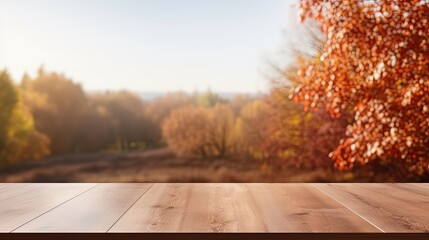 Naklejka na ściany i meble empty wooden table in modern style for product presentation with a blurred autumn landscape in the background