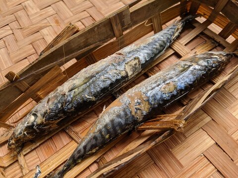 Raw pindang fish in bamboo basket, salted and seasoned fish, asian raw food ingredients