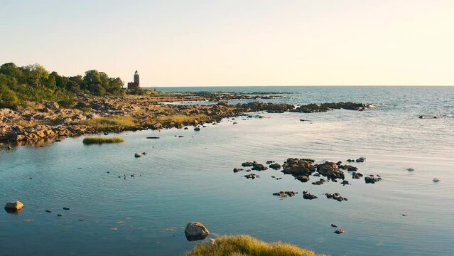 early morning on the coast of bornholm with lighthouse in 4K