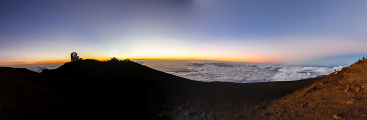 Panorama of Hawaii's landscape over the clouds during sun rise