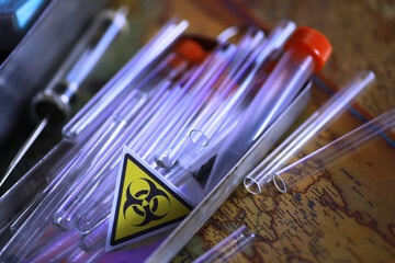Ukrainian flag biohazard and test tubes. Assistance to Ukraine in biolaboratories. Western...