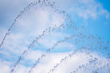 Splashes of water against the blue sky background