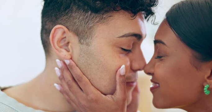Face, touch nose and a couple at home with love, support and care. Closeup of a man and woman partner happy together in healthy relationship, commitment and intimate moment with a smile and trust