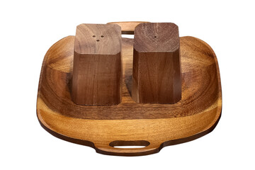 A wooden tray with salt and pepper shaker