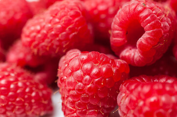 Delicious fresh ripe raspberries on white background
