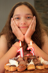 Teenager girl portrait anniversary including birthday cake and candles