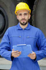 a male engineer with clipboard