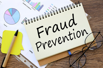 Fraud prevention . office desk, financial charts. words on the page