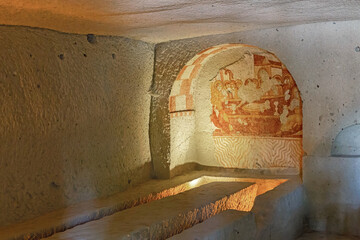 Refectory of Sandal church with scene of the Last Supper in wall recess. Goreme Open air museum....
