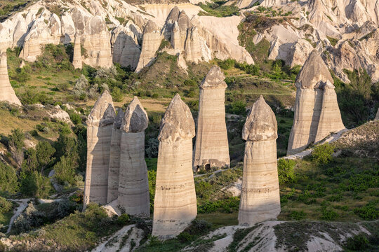 Fairy Chimney rock formations of Cappadocia. Love Valley with stones in form of huge phalluses made by nature. Famouse nature attraction. Goreme, Turkey (Turkiye)