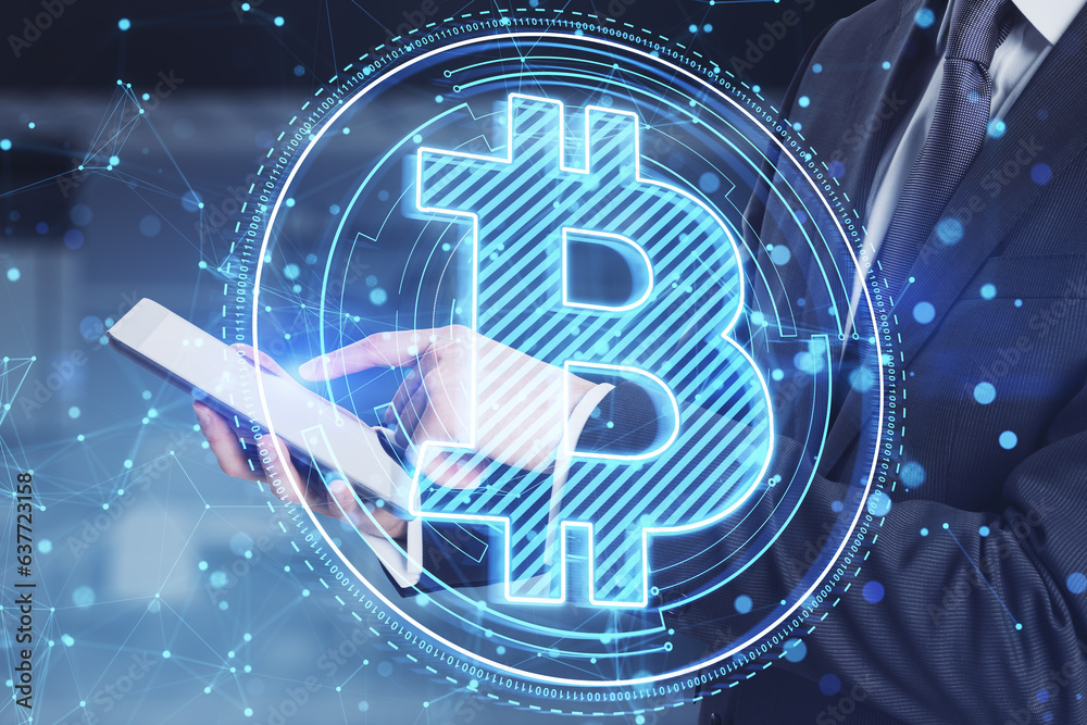 Poster close up of businessman hand using cellphone with glowing blue polygonal bitcoin hologram on blurry 