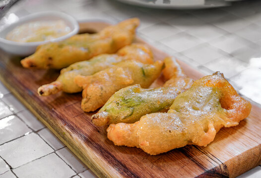 Traditional delicacy from South of France, fried courgette or zucchini flowers at a restaurant, Saint Paul de Vence, French Riviera, South of France