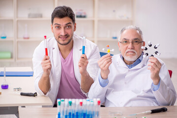 Two male chemists working at the lab