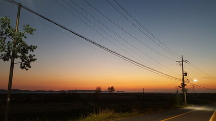 Fototapeta na wymiar sunset on the road