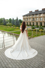 Obraz premium Fashion bride in wedding dress. Summer wedding