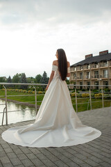 Fototapeta na wymiar Fashion bride in wedding dress. Summer wedding