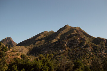 Mountainous and Hilly Landscape with Blue Sky Background