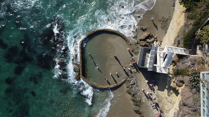 Aerial View of Tide Pools With Sea Foam and Ocean Waves