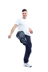 Fototapeta premium The laughing man lifted his leg up in front. Energy, activity and movement. Full height. Isolated on white background. Vertical. Space for text.