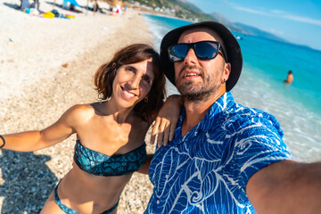 Selfie of a couple on the beach of the Albanian riviera called Borsh in Vlore, Albania