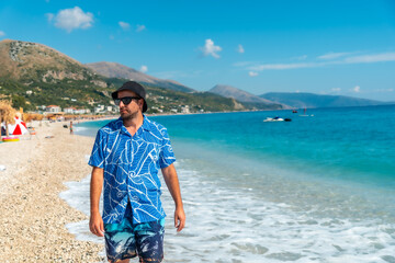 A young tourist on the beach of the Albanian riviera called Borsh in Vlore, Albania