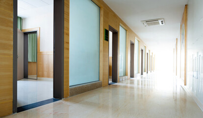Fototapeta na wymiar Empty long corridor in the hospital
