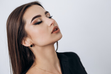 Close up fashion portrait of young pretty indian latin american woman posing in photo studio on...