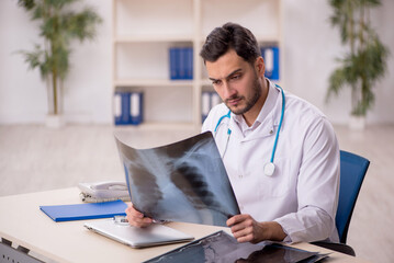 Young male doctor radiologist working in the clinic