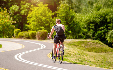 Cyclist ride on the bike path in the city Park
