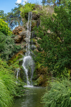 Rock Waterfall in the Bagatelle Park. The Park is located in Boulogne-Billancourt near Paris, France