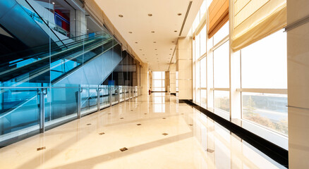 Corridor in office building with big window and curtains
