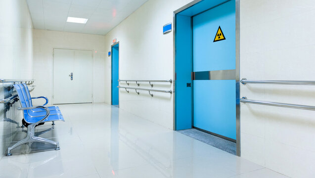 Empty chairs in hospital hallway - Powered by Adobe