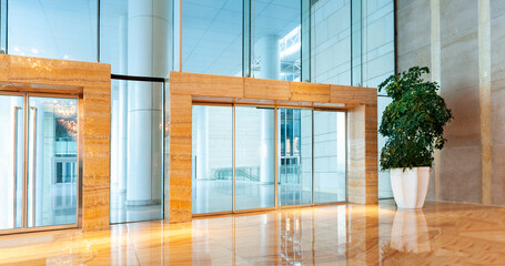 Modern office building with glass doors and wall
