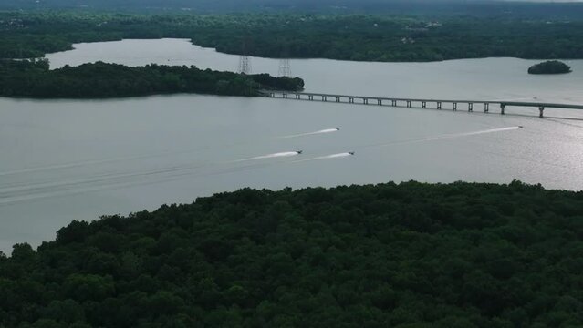 Watercraft Ove Serene Water Crossing Bridge At Percy Priest Lake In Long Hunter State Park, Tennessee, USA. Aerial Drone Shot