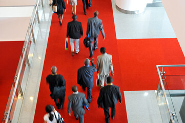 Moving business people in a international exhibition
