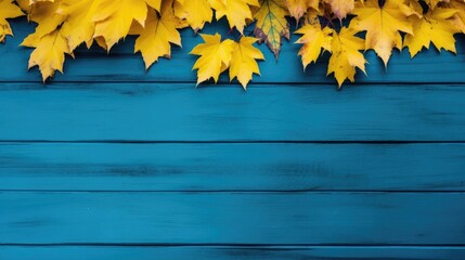 Autumn leaves on blue wooden background. Top view with copy space